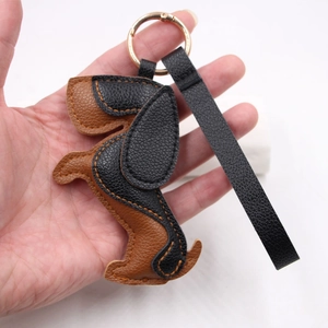 Premium PU leather dachshund dog keychain with long ears and black leather hand strap