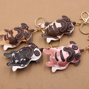 Pug shaped leather car keychain charms in four colorful patterns with gold metal rings