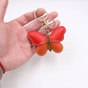 Handmade red and orange butterfly leather keychain with gold metal ring and lobster clasp