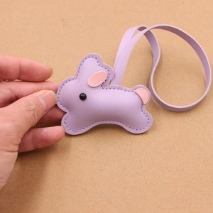 Cute purple leather rabbit bag charm with pink accents and matching wrist strap