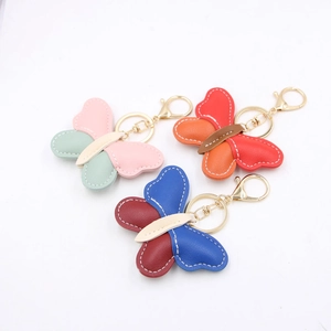 Handmade layered butterfly leather keychain with gold lobster clasp in three vibrant colors
