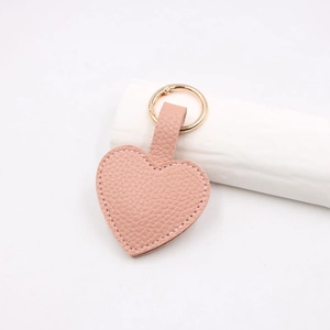Pink heart-shaped lychee texture PU leather keychain with gold metal ring clasp