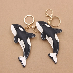 Orca shark skin leather keychain pair with gold lobster clasp and white stitching detail
