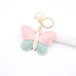 Chic butterfly leather keychain with pink and mint green patchwork and gold clasp