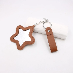 Porte-clés miroir en cuir marron en forme d'étoile avec dragonne et anneau argenté