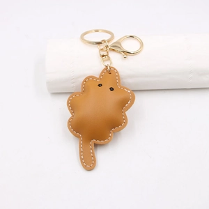Creative brown leather animal-shaped keychain with fine white stitching and gold lobster clasp