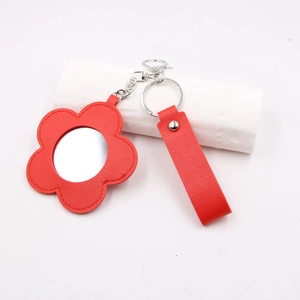 Porte-clés fleur en cuir rouge avec petit miroir, anneau argenté et dragonne assortie