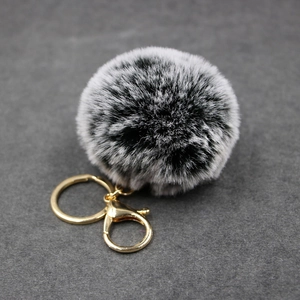 Faux rabbit fur keychain with black and white leopard spots and golden lobster clasp