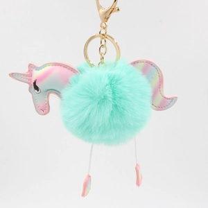 Plush mint green unicorn pompom keychain with iridescent leather details and gold clasp