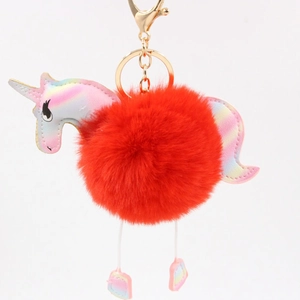 Rainbow unicorn plush ball keychain with golden metal clip on a white background