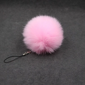 Pink fluffy faux fur pom pom keychain with black lanyard and silver metal lobster clasp