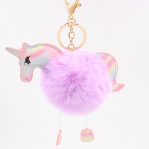 Colorful unicorn pompom keychain with iridescent leather detail and golden lobster clasp