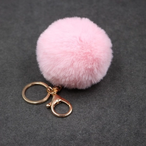 Porte-clés pompon en fausse fourrure rose avec fermoir mousqueton doré pour sac à main