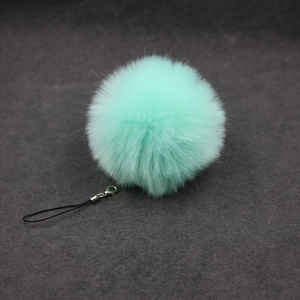 Pluffy faux fur mint green pompom keychain with silver lobster clasp and black lanyard