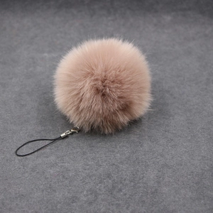 Plush 8cm faux fur ball keychain in camel with silver lobster clasp and black lanyard
