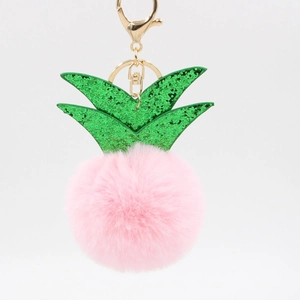 Pink pineapple faux fur keychain with green sequin leaves and golden metal clasp