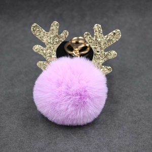 Purple faux fur pom pom keychain with golden reindeer antlers for bags and cars