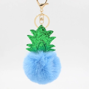 Creative pineapple Christmas plush pom-pom keychain with blue fur and green glitter leaves