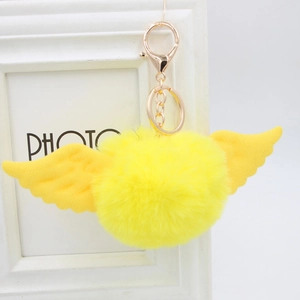 Cute bright yellow faux fur pom pom keychain with angel wings and gold lobster clasp