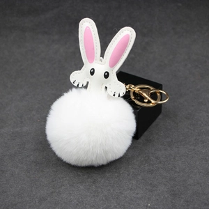 Cute white plush rabbit keychain with fluffy pompom and gold hardware for bags