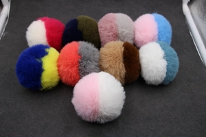 Set of nine colorful two-tone plush pompom keychains for bags and DIY accessories