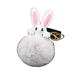 Cute bunny plush keychain with gray faux fur pompom and pink leather ears on white background