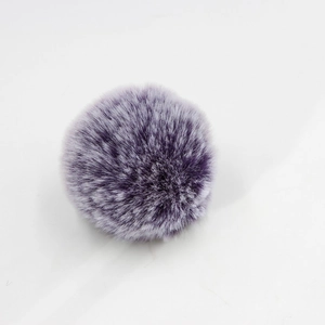 Purple faux rabbit fur pom pom ball for bags and keychains with fluffy texture