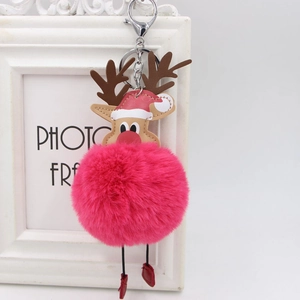 Detail of pink faux fur reindeer keychain with brown antlers and silver metal lobster clasp