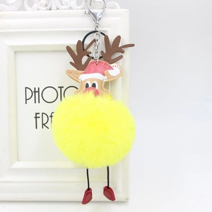 Detail view of reindeer keychain featuring yellow plush pompom and brown leather antlers