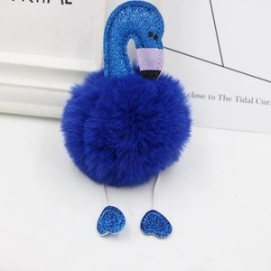 Detail of blue plush flamingo keychain featuring sequin neck and heart shaped feet decor