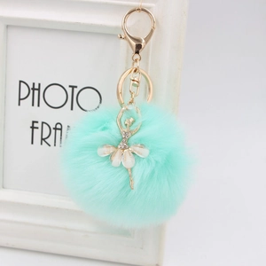 Cute mint green faux rabbit fur pom pom keychain with rhinestone ballet dancer charm