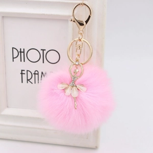 Cute pink faux rabbit fur ball keychain with rhinestone ballet dancer pendant in gold finish