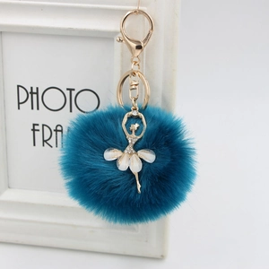 Deep blue faux fur ball keychain with rhinestone ballet dancer gold metal charm