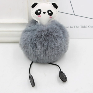 Close-up of cute panda plush keychain with grey fluffy pompom and long soft legs