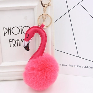 Detail of pink plush flamingo keychain with gold metal lobster clasp and ring
