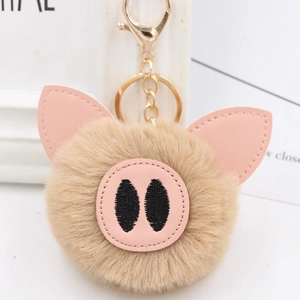 Cute pig fur ball keychain with pink leather ears and gold metal clasp for bags
