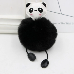 Close-up of adorable panda plush keychain featuring a fluffy faux fur ball and leather head