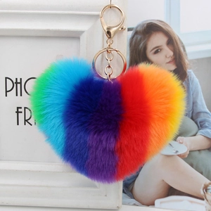 Rainbow heart-shaped plush keychain with golden lobster clasp and colorful fur ball