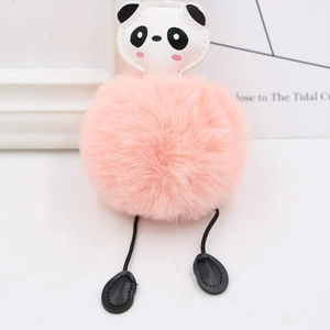 Detail of pink faux fur panda keychain with cute leather face and fluffy texture