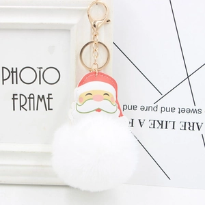 Santa Claus keychain with a large white faux fur pompom and golden lobster clasp