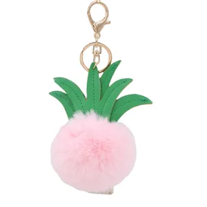 Pink pineapple faux fur pompom keychain with green leather leaves and gold lobster clasp
