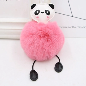 Close-up of a fluffy pink plush ball keychain with a cute panda head and dangling legs