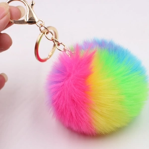 Rainbow faux fur pompom keychain with golden lobster clasp and colorful gradient plush ball