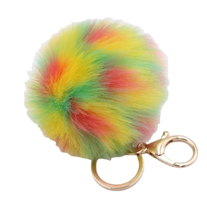 Multi-color faux fur pompom keychain with gold lobster clasp and ring on white background