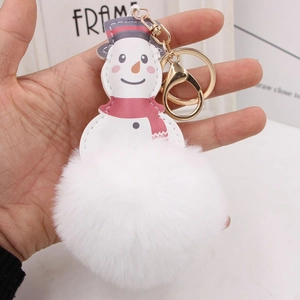 Christmas snowman plush keychain with white faux fur pompom and red scarf detail
