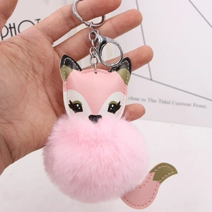 Cute pink fox fur pompom keychain with leather details and silver metal clip