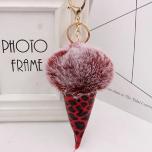 Detail of burgundy leopard print ice cream cone keychain with gold carabiner