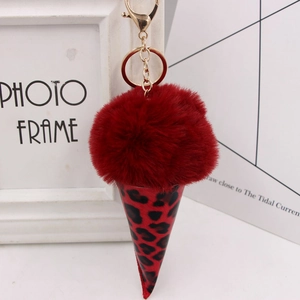 Leopard print ice cream plush keychain with red faux fur pompom and gold lobster clasp