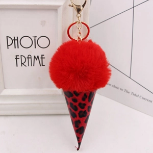 Detailed view of red plush faux fur ice cream pendant with leopard print cone and gold clip