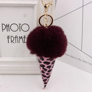 Detail of burgundy plush faux fur ice cream keychain with pink leopard print cone base